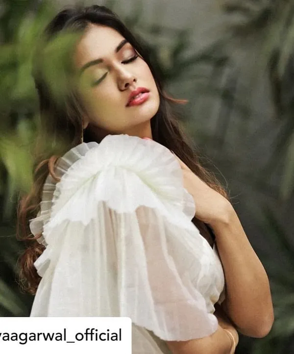 The stunning Divya Agarwal wears our white crop top with a dramatic, single-sided organza ruffle sleeve. This piece is part of our collaboration with Bohoraani and showcases our love for modern, architectural details.