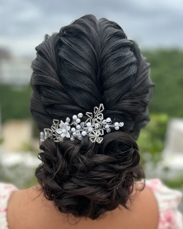 A beautifully intricate textured updo, perfect for a Christian bride or a reception look. I teach how to create these soft, overlapping textures for a romantic finish.