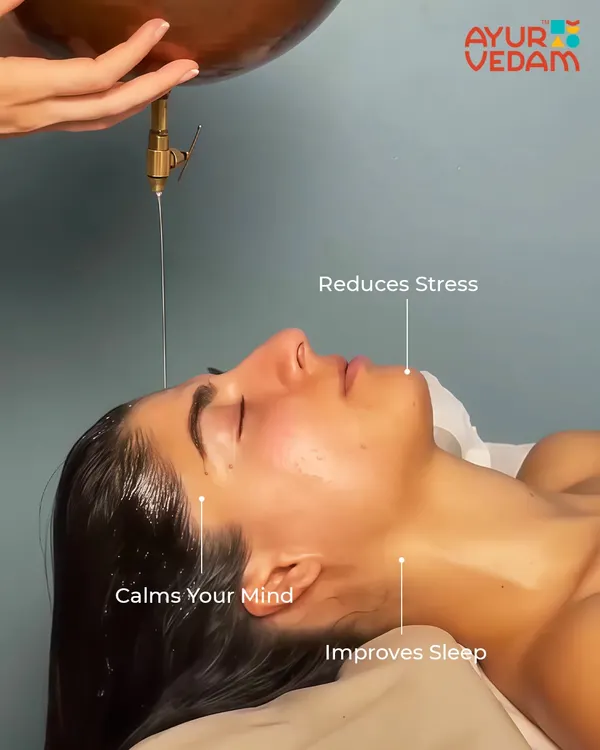 A close-up of a client experiencing Shirodhara. This therapy is incredibly effective at reducing stress, calming the mind, and improving sleep quality by soothing the entire nervous system.