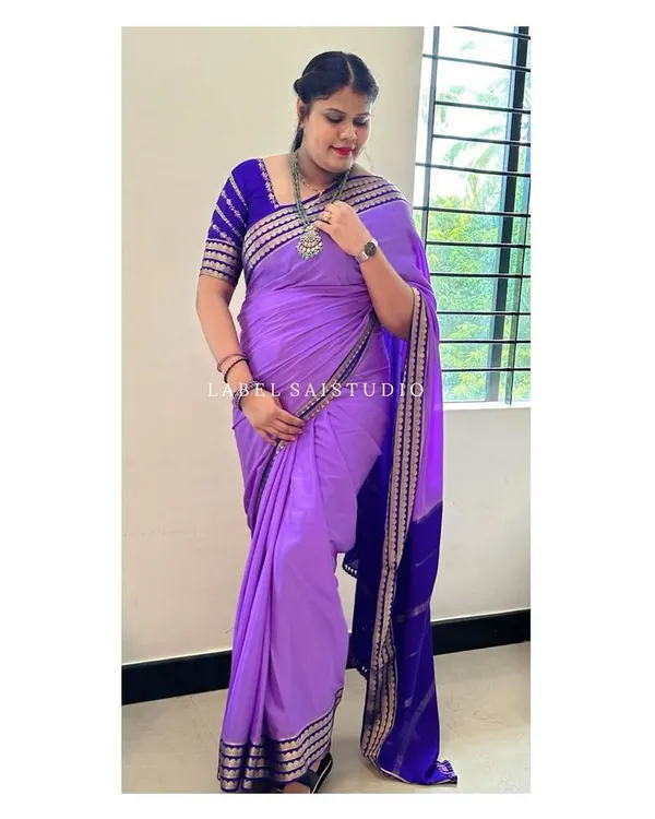 This is a pure Mysore crepe silk saree in a trending lavender and royal blue combination. It is a 120 GSM thickness material with a beautiful flower border, a design in which we have sold many other color combinations.