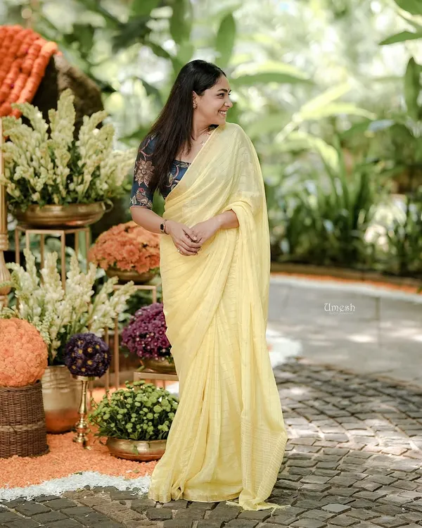 The beautiful actress looking absolutely radiant in a simple, elegant yellow saree from my collection. The way the light catches the fabric shows how lovely and comfortable it is to wear.