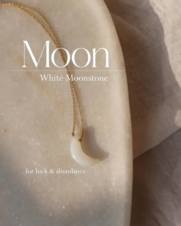 Manifest your dreams with my White Moonstone Luna pendant. This crescent moon, carved from a stone of luck and abundance, is a powerful tool for attracting good fortune in love and business.