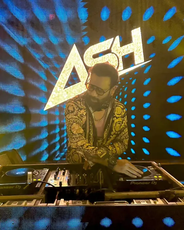 In the zone, unleashing the beatmaker within. A great shot from a recent gig, with my custom 'ASH' visuals lighting up the stage behind me.