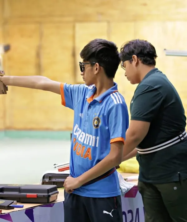 This is what it's all about. Personal guidance for a young shooter wearing the India colors with pride. At our summer camp, we focus on one-on-one coaching to build a strong foundation in 10M air pistol and rifle shooting.
