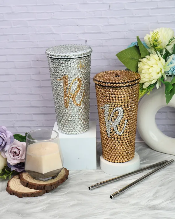 Ready to shine? My personalized bling tumblers are perfect for adding sparkle to every sip. This image shows the silver and gold options, both customizable with a rhinestone initial.