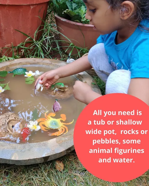We believe in learning through joyful, messy play. Here, one of our littles is completely absorbed in creating a story in our pretend pond, a perfect example of a sensory play activity that engages the imagination and connects children with nature.