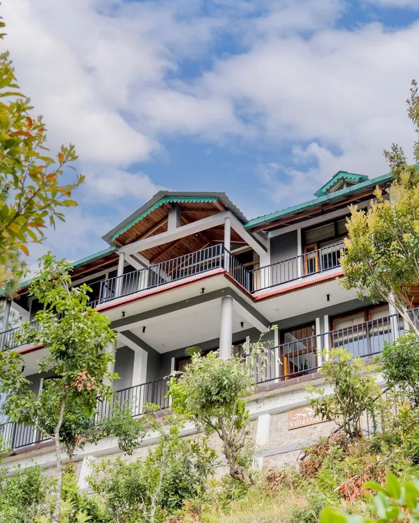 An exterior view of 'The Mountain Home', showcasing its multi-level architecture designed to integrate seamlessly with the surrounding landscape.
