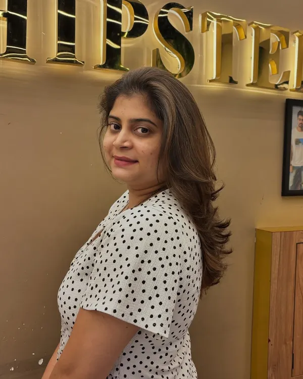 A side view of a client's hair after a grey coverage and highlighting service. The result is a natural-looking blend that adds dimension and a youthful glow.