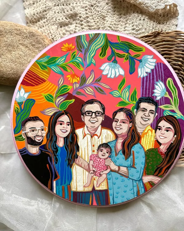 A beautiful family portrait painted on a large decorative plate. I love combining individual personalities and the warmth of the entire family into a single, vibrant piece of art.