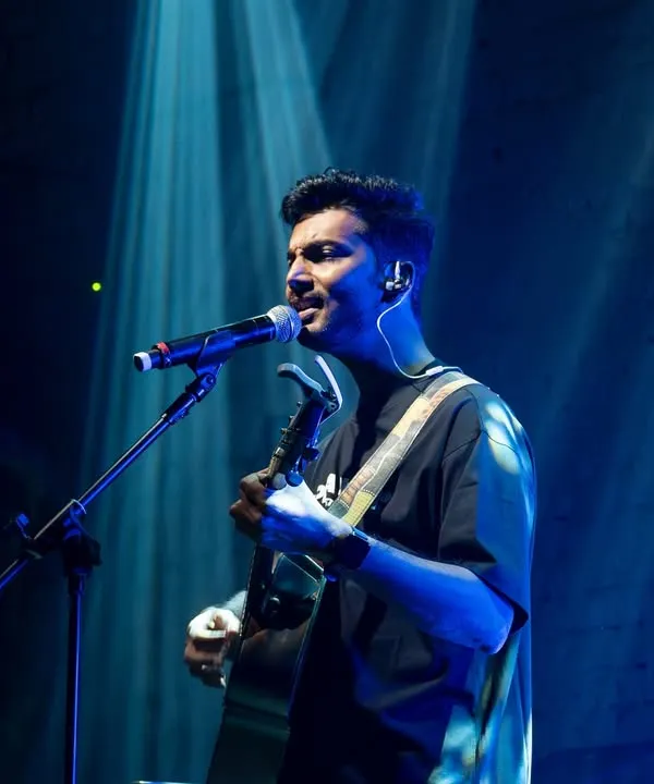 Lost in the music and the moment. This is what it feels like when I'm on stage, just me, my guitar, and the energy from the crowd. This solo performance under the spotlight is where the magic happens.