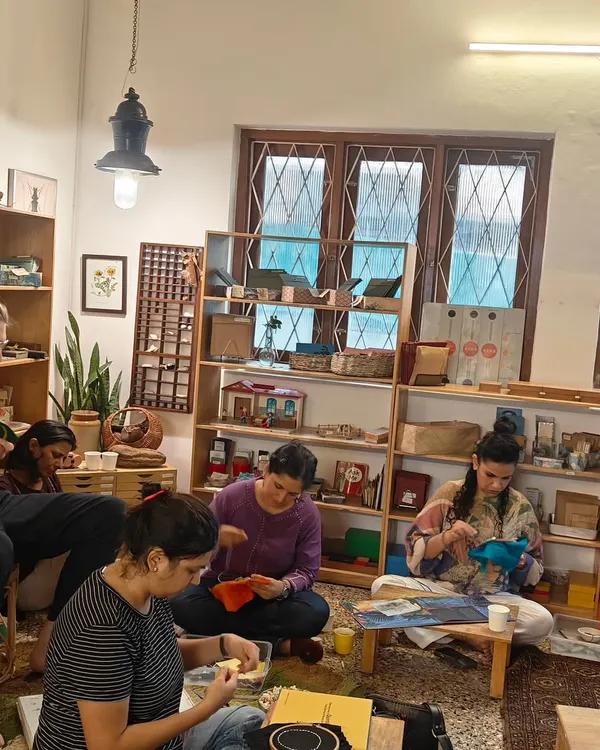 A wide view of our sewing circle, where parents came together to create a special canopy for our graduating children. This is what community looks like: hands and hearts working together with shared purpose.