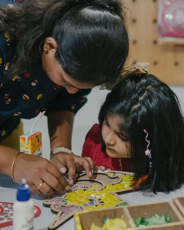 This is what an art party looks like! A mother and child are completely absorbed in creating a beautiful mosaic together. My parties are all about bonding, creating, and making wonderful birthday memories.