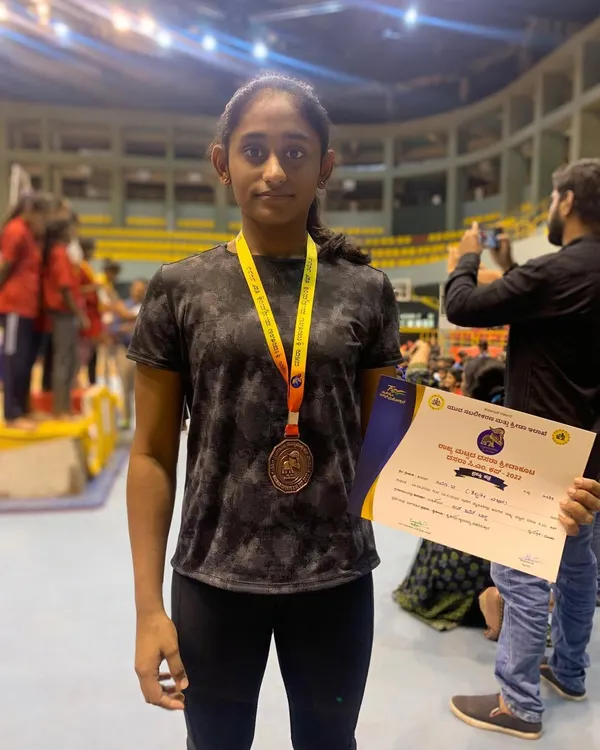 Celebrating Riya B's fantastic achievement. She secured the Bronze medal on the Uneven Bars at the State Dasara sports meet, a testament to her hard work and dedication.