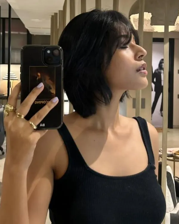 A year later and we're back with a fresh chop. This textured, choppy bob with soft bangs is effortlessly cool and easy to style.