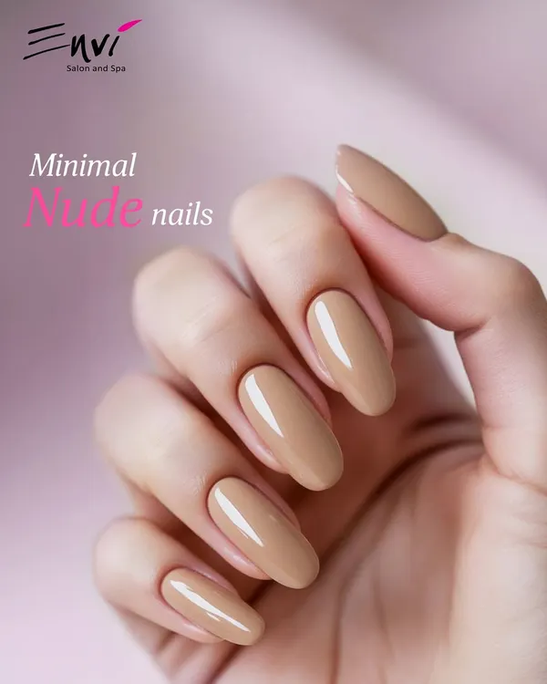 The epitome of elegance: a minimal nude manicure. This look features perfectly shaped, medium-length almond nails with a glossy, neutral polish for a sophisticated and clean finish.