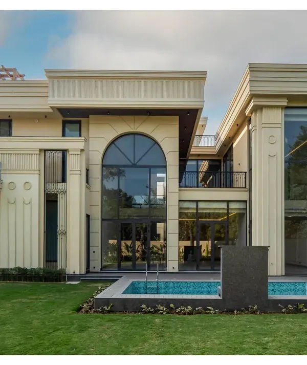 This masterpiece in Sultanpur, New Delhi, is a perfect blend of classical charm and modern sophistication. The facade features grand arches, decorative columns, and impressive double-height glass, creating a majestic and timeless appeal.