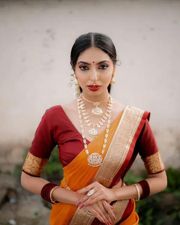 This is the kind of timeless portrait I love to create. The focus is on the rich details of the traditional saree, the intricate jewelry, and the model's confident expression, all brought to life with soft, natural lighting.