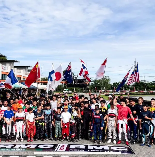 Representing India on the international stage. Our drivers stand with competitors from around the world at the RMC Asia Trophy, a proud moment for the entire team.