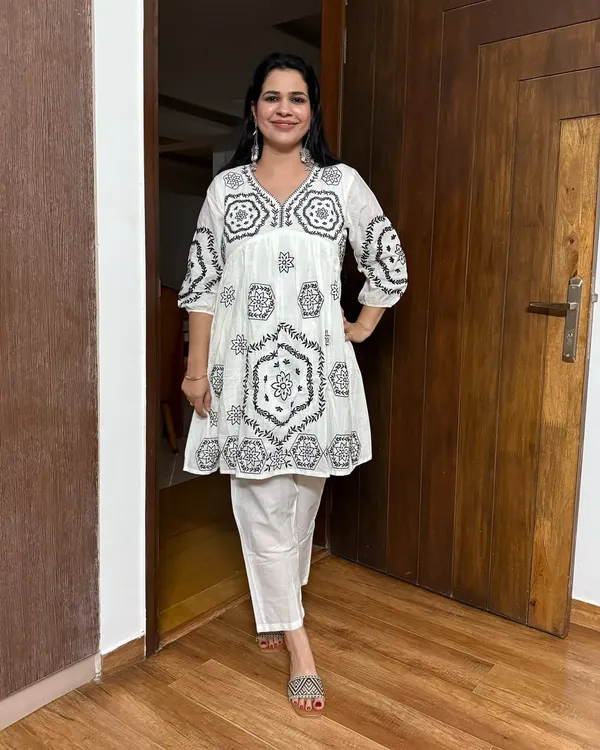 A look at one of my favorite accessories: statement earrings. This white embroidered peplum top and pant set is the perfect canvas for these beautiful silver earrings.