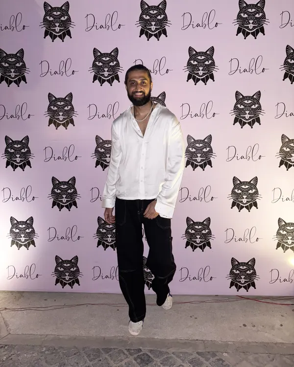 A full front view of a custom-made white party shirt. The relaxed fit and open collar give it a modern, stylish feel, perfect for a night out.