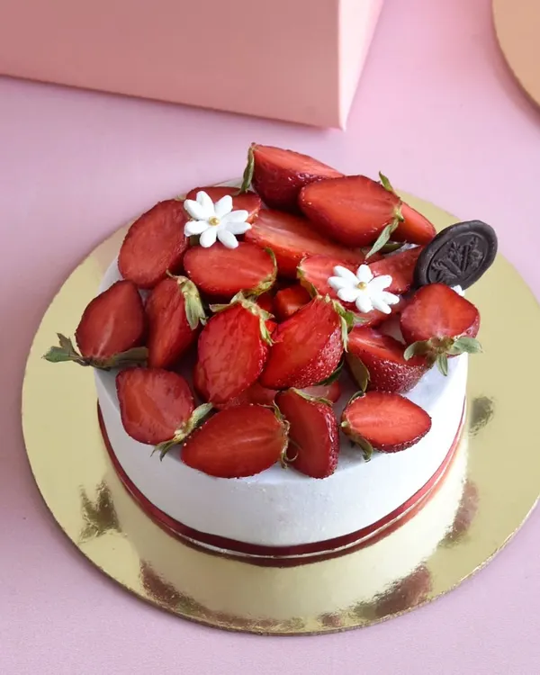 Our simple and elegant Strawberry Shortcake. It features layers of light vanilla sponge, fresh whipped cream, and lots of juicy strawberries. A seasonal hit for years.