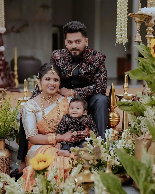 A cherished family portrait from a newborn naming ceremony. I focus on capturing these first precious moments as you celebrate with your little one, surrounded by beautiful traditional decor and the warmth of your loved ones.