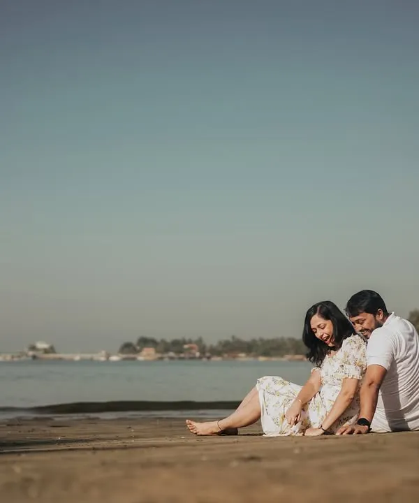Sanket and Apeksha sharing a quiet moment on the sands of Goa. Our destination pre-wedding shoots are designed to be a fun experience, letting us capture your story against a stunning landscape.