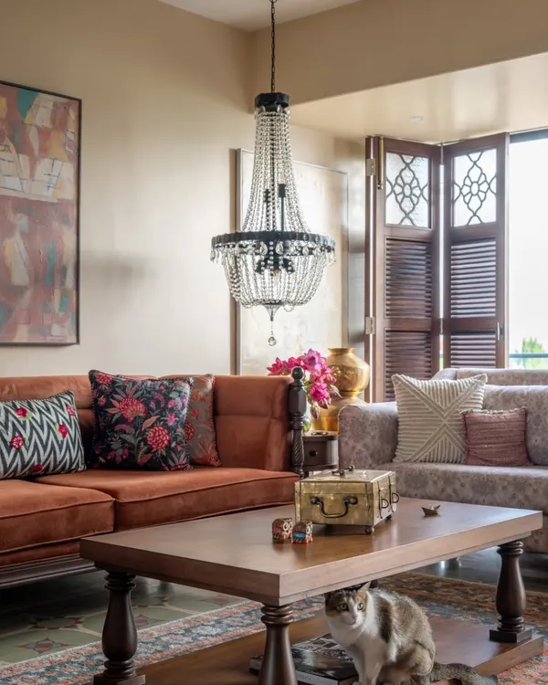 This Calcutta living room was designed to hold the energy of a full-hearted, joint-family. The space is warm and rooted, with earthy tones, comfortable furniture, and even a spot for Peru the cat under the coffee table. It feels generous, grounded, and deeply lived-in.
