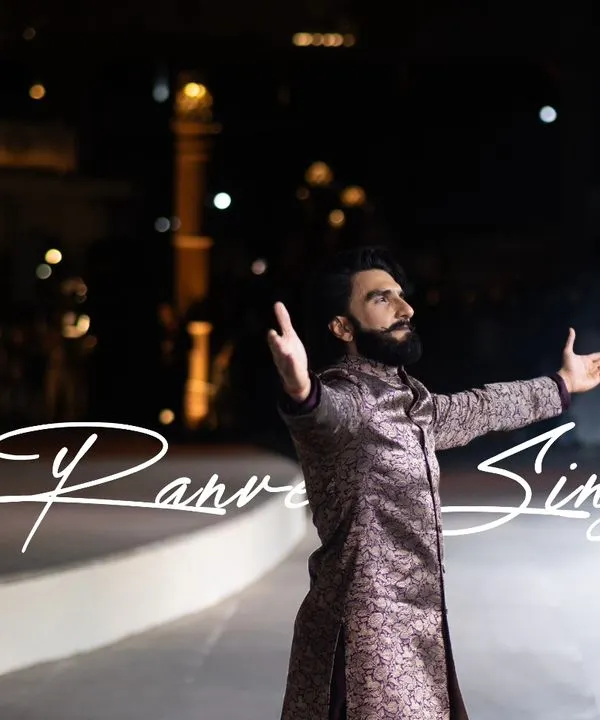 A signature shot of Ranveer Singh from the 'Dharohar Kashi Ki' fashion show. The text overlay makes it a perfect piece for promotional content, highlighting the star of the evening.