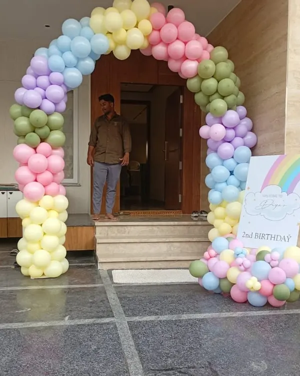 This beautiful pastel rainbow balloon arch creates a dreamy and welcoming entrance for a second birthday party. We use a soft color palette to craft a sophisticated yet playful look, perfect for celebrating your little one's milestone.