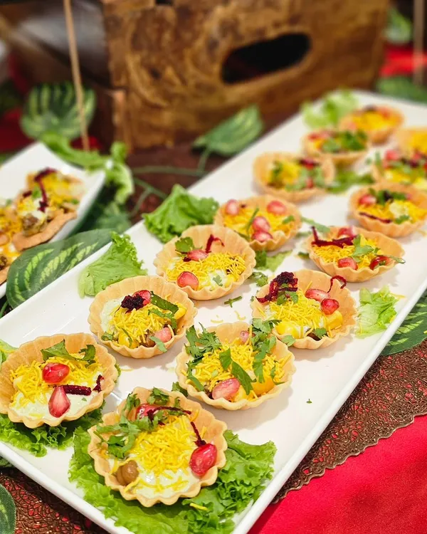 Enjoy the authentic taste of chaat with my beautifully arranged chaat bites. This setup for a brand launch features papdi chaat and other tangy treats, complete with all the chutneys and toppings.