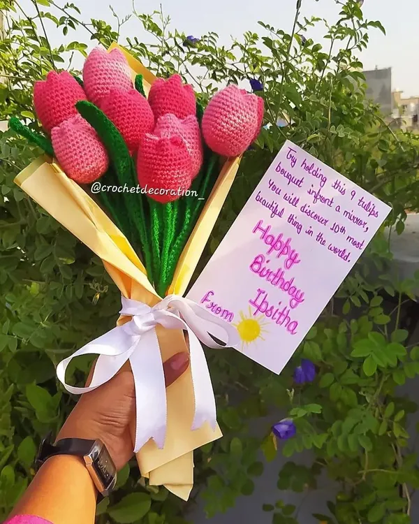 A stunning birthday bouquet of nine pink crochet tulips, complete with a personalized message card. This is a perfect example of how we help you create a heartfelt and memorable gift.