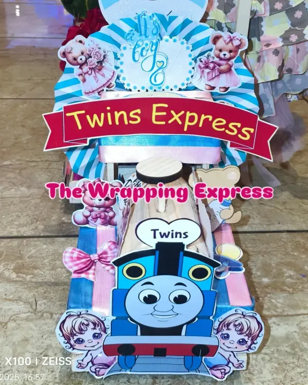 The 'Twins Express' train engine, designed for a baby boy and girl. I use both blue and pink colors and cute twin-themed cutouts to make it special.