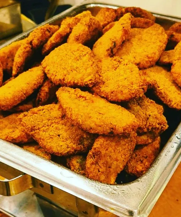 A perfect tray of our Bengali Fish Fry, golden and crispy. We use a traditional recipe with a breadcrumb coating that gives it a satisfying crunch while keeping the Bhetki fish inside tender and moist.
