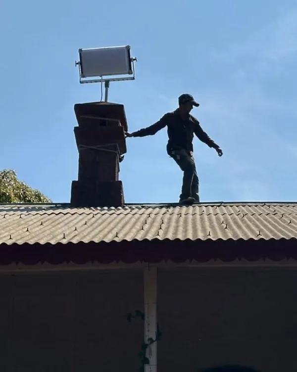 This is what it takes to get the perfect shot. Here, a member of our crew prepares a Creamsource Vortex8 on a rooftop to create a realistic moonlight effect. We handle challenging rigging in any location to help the cinematographer achieve their vision.