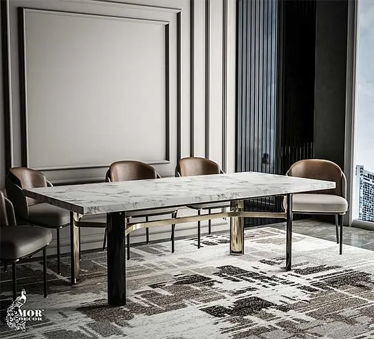 Our Delight dining table, where elegance meets functionality. The sleek marble top is supported by a dynamic metal and wood base, creating a sophisticated haven for any dining space.