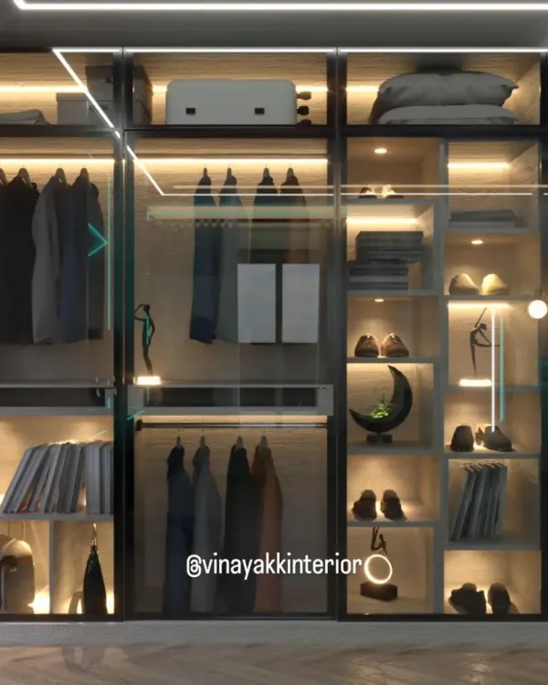 This is organization elevated to an art form. A walk-in wardrobe with transparent glass shutters and integrated LED lighting turns your collection of clothes, shoes, and accessories into a stunning display. It's not just storage; it's a personal boutique.