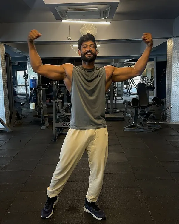 My biceps are my secret weapons. A classic double bicep pose to show the results of consistent arm training.