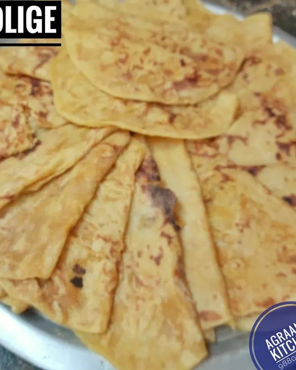 Bele Holige, or Obbattu, is a festive delicacy that everyone loves. This soft, sweet flatbread is filled with a delicious mixture of cooked lentils and jaggery, and cooked with ghee until golden.