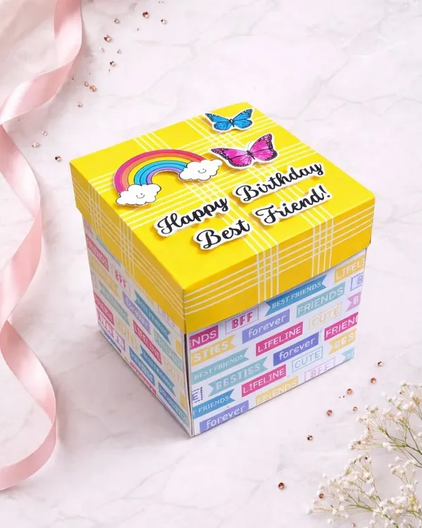 This bright yellow box is perfect for a best friend's birthday. The lid is decorated with rainbows and butterflies, hinting at the colorful surprise waiting inside.