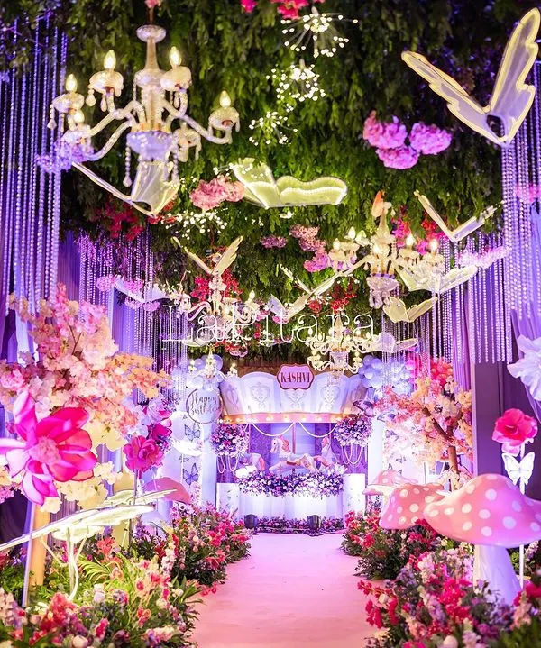 Step into a real-life fairytale. This enchanted garden entrance was designed to create a breathtaking first impression, with a magical pathway lined with glowing mushrooms, whimsical creatures, and a ceiling of lush greenery and illuminated butterflies. It's this level of immersive detail that transforms a party into a spellbinding experience.