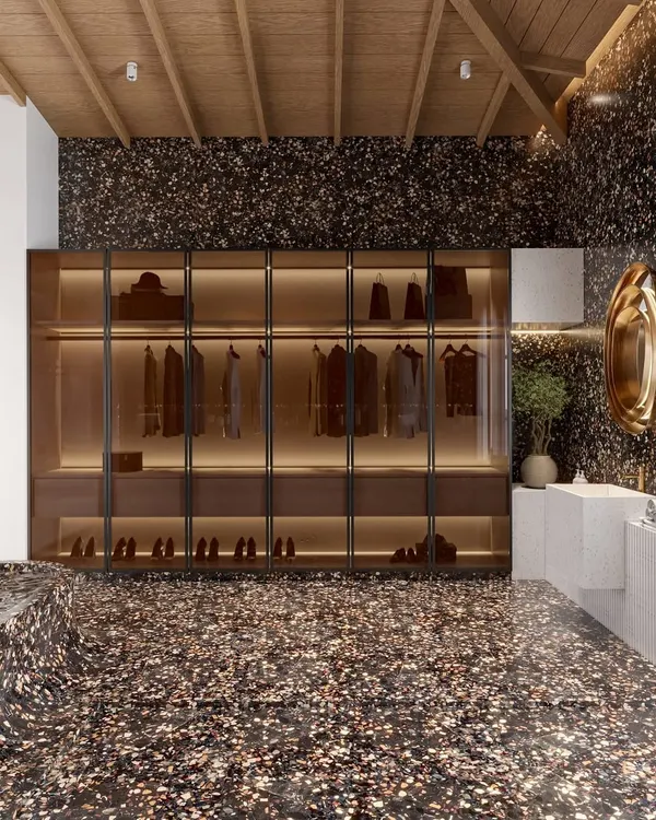 I designed this bathroom to be a statement of modern glamour. The space is defined by a bold terrazzo finish that flows from the floor up into a sculptural, sunken tub. This, combined with a warm vaulted wood ceiling, creates a dramatic yet inviting spa-like sanctuary.