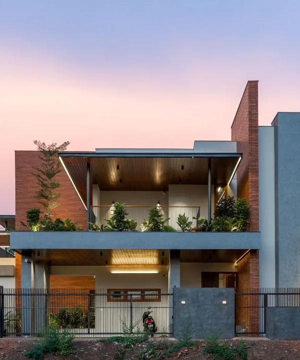 This is the Madani Residence at dusk, a project where we blended modern architectural lines with warm, inviting light. We believe a home's exterior should be a promise of the peace and beauty that lies within, using elements like cantilevered roofs and integrated planters to connect the structure with nature.