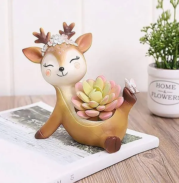 This adorable deer-shaped resin planter is perfect for holding a small succulent. Its sweet, cheerful design makes it a wonderful decorative piece for a child's room or a nature lover's desk.