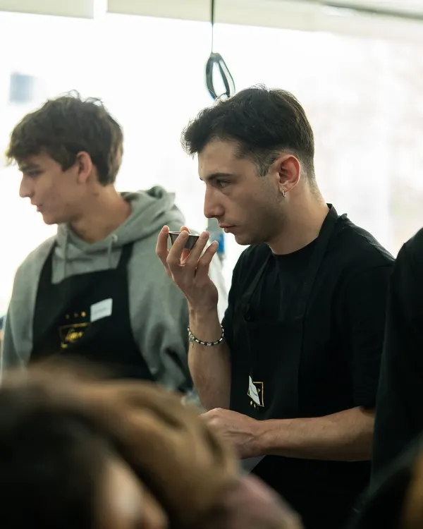 A student from UNISG, Italy, carefully tasting and analyzing flavors during a specially curated workshop at Lavonne.