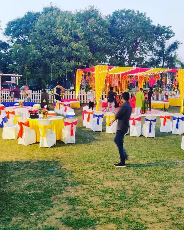 A vibrant outdoor mehandi setup we catered for, with colorful decor and socially distanced seating. We can adapt our service style to any venue and theme.