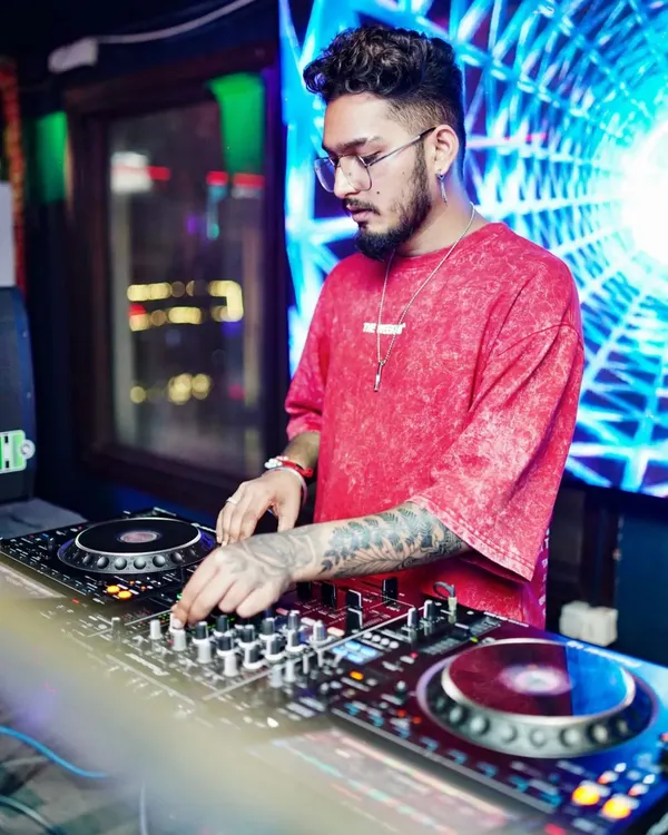 Deep in concentration, adjusting the levels for the perfect transition. Every track is carefully selected to match the mood and energy of the crowd.