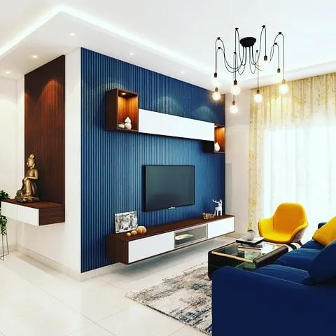 A modern living room in Bangalore featuring a ribbed texture accent wall in deep blue. I focus on creating clean lines and a high-quality finish for every interior painting project.