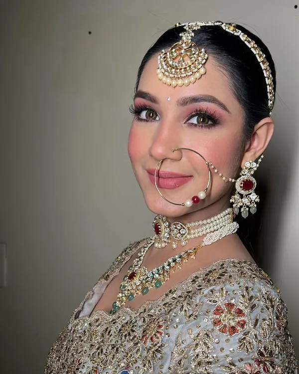 A close-up of this stunning bridal look. Notice the soft, blended eyeshadow, the perfectly defined brows, and the radiant skin. Her smile says it all.