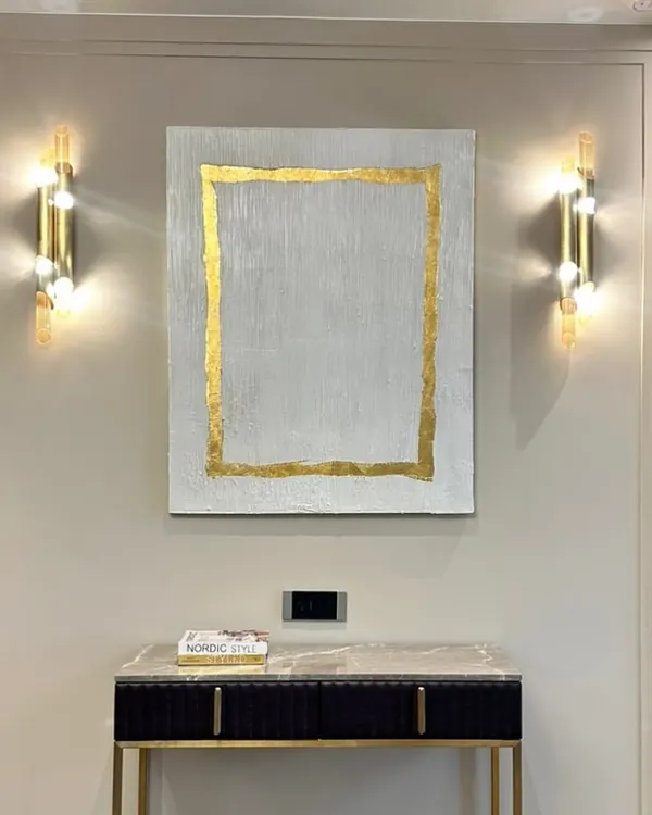 This textured painting with a simple gold leaf border was installed in a beautiful Hyderabad home. The gold frame is part of the artwork itself, adding a touch of glamour to the minimalist, textured piece.
